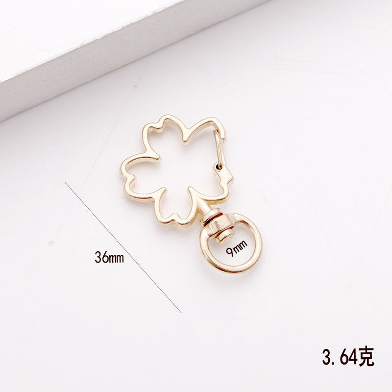Wholesale shaped keychain metal cat dolphin love five-pointed star cherry blossom shell jewelry accessories diy